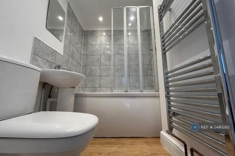 Family Bathroom With Shower Over Bath, Basin, Loo