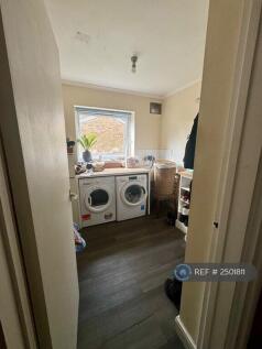 Large Utility Room With Appliances And Storage 