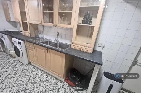 Utility Room With Bosch Washing Machine And Drier 