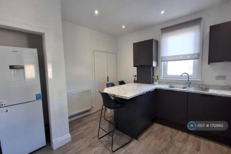 Kitchen With Fridge/Freezer And Washing Machine