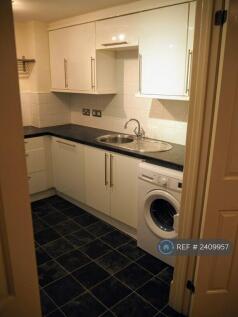 Kitchen With Washing Machine And Dishwasher
