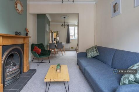 Welcoming Lounge With Fireplace And Dining Area