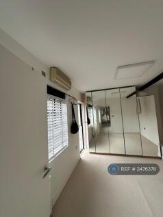 Bedroom 2 With Large Windows And Fitted Wardrobes