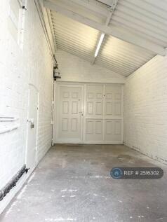 Garage View Leading To Front Of House Driveway