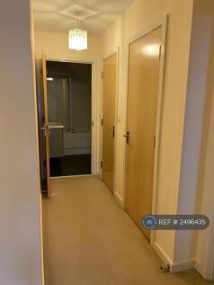 Hallway Leading To Big Bathroom