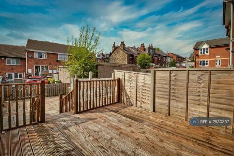 Decking With Steps Down To Paved Are