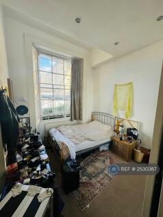 Bedroom. King Size Bed With Wall To Wall Closet.
