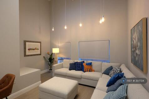 Living Room. High Ceilings &amp; Air Conditioning.
