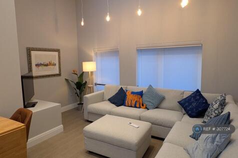 Living Room. High Ceilings &amp; Air Conditioning.