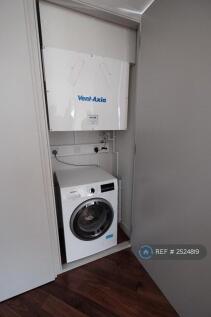 Washing And Dryer In Cupboard
