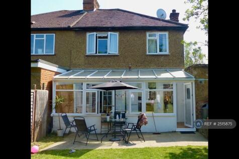 Back Garden And House With Conservatory