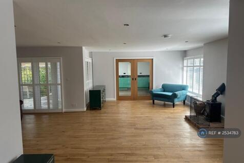 Family Room With Sliding Doors To Kitchen