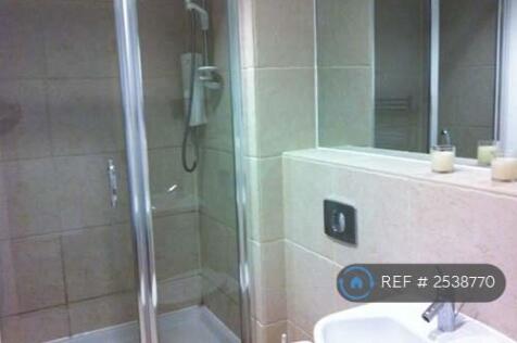 Limestone Tiled Bathroom With Electric Shower