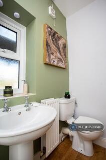 Bathroom With Shower, Sink Basin And Toilet