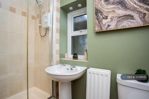 Bathroom With Shower, Sink Basin And Toilet