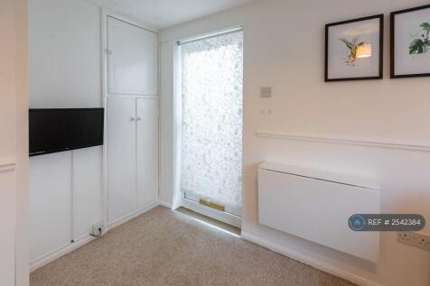 Main Room, Fitted Storage Cupboards And Wardrobe.