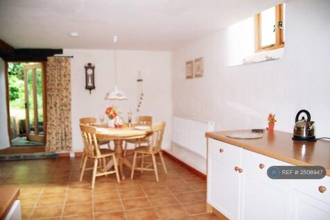 Dining Area Showing Door To Woodland