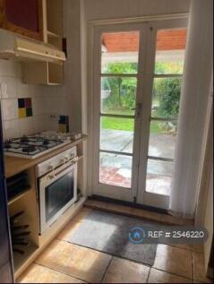 Kitchen French Doors Leading To Patio And Garden