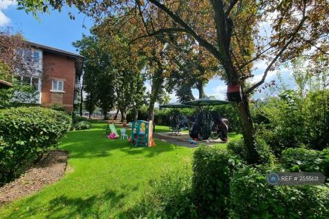 Shared Garden In Front Of Apartment Building