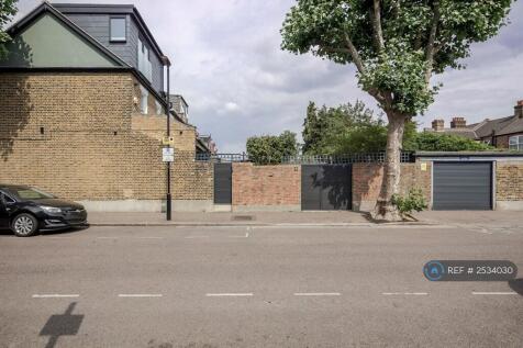 Side View With Double Garage And Gates 