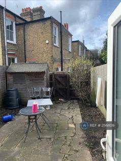 Back Garden With Shed And Fruit Tree