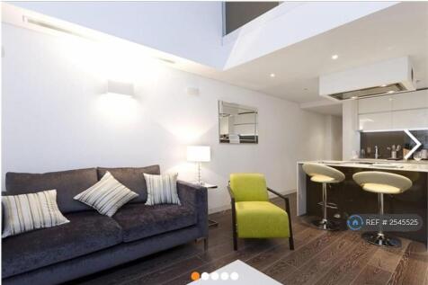 Living Room On First Floor And Open Kitchen