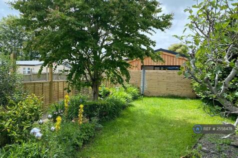 Garden With Cabin At End