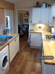 Kitchen With Door To Back Yard