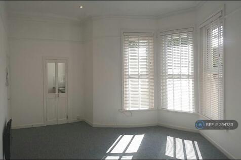 Living Room w/ Doors To Kitchen