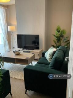 The Living Room Has a 50 Inch Hd Tv