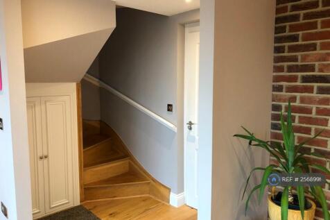 Entrance And Stairs To Upper Level