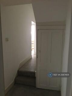 Hallway And Door To Cellar