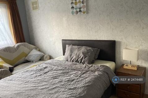 Bedroom With Back Garden View