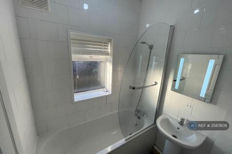 Floor To Ceiling Tiled Bathroom
