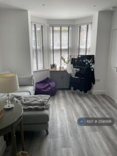 Open Plan Lounge With Bay Window.
