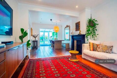 Beautifully Arranged Dual Lounge And Dining Area