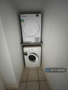  Utility Room With Sink, Washer &amp; Dryer