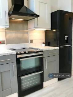 Kitchen With Brand New Cooker And Fridge Freezer
