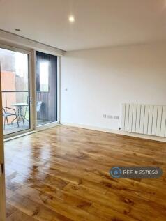 Living Space, With Floor To Celing Balcony Doors. 