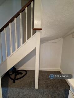 Under Stairs Storage View From Kitchen