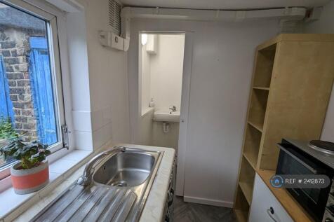 Kitchen With Shower Room Beyond