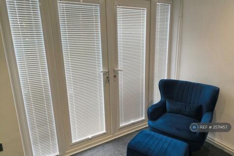 Arm Chair And Footstool In Lounge