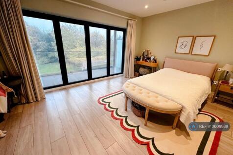 Master Bedroom And Access To Upstairs Balcony
