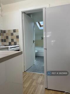 Kitchen Leading To Bathroom