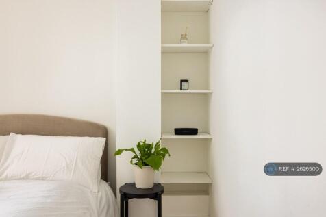 Bedroom 2 - Floor-To-Ceiling Shelf