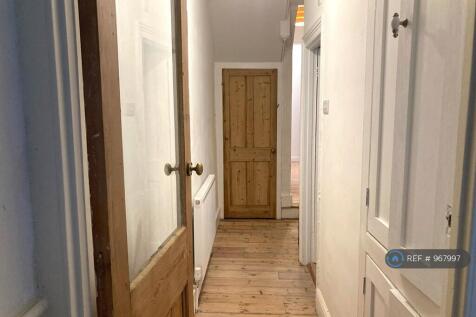 Hallway With Original Flooring &amp; Built In Cabinets