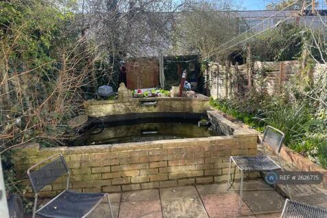 Rear Private Garden With Raised Fish Pond 