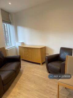 Has 3 Large Windows Across Span Of Room