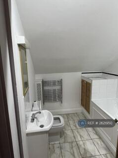 Bathroom With Washing Machine In Cupboard
