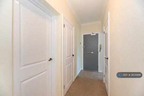 Hallway With Grey Apartment Door 